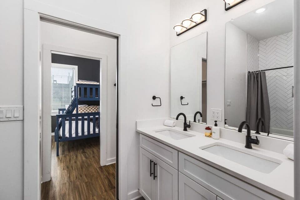 Bedrooms #3 and 4 are connected thru separate closet spaces and a Jack-and-Jill bathroom with a shower/tub combo.
