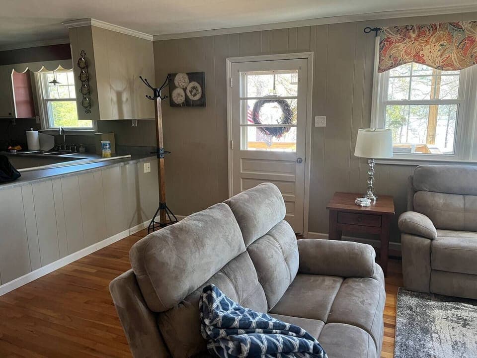 Family Room with new Leather Sofa and Love Seat.  Each with Reclining Chairs