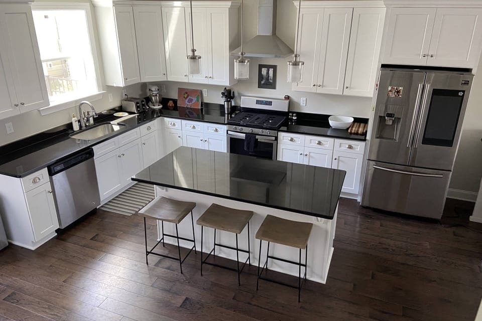 Fully stocked kitchen has ample dishes, glasses, silverware, bowls, pots and pans for quick food on the run or full meals.