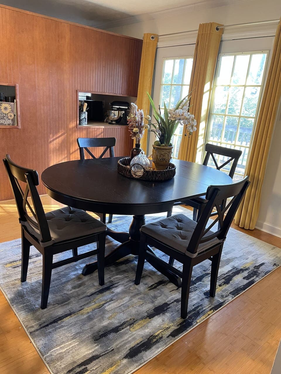  The dining table expands out to seat six people. We have additional chairs.