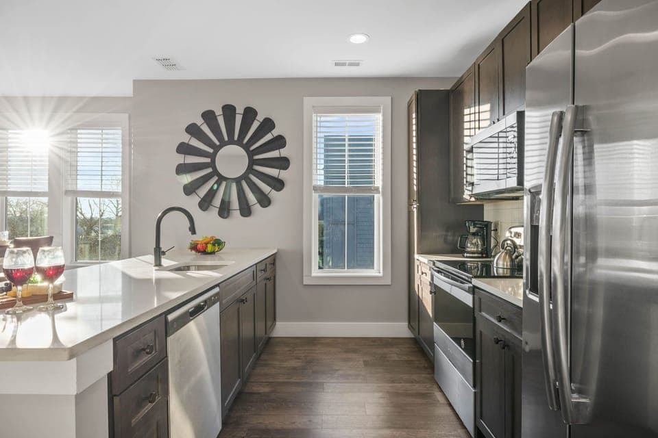 Fully equipped kitchen stocked with your basic cooking essentials, stainless steel appliances, and breakfast bar seating.