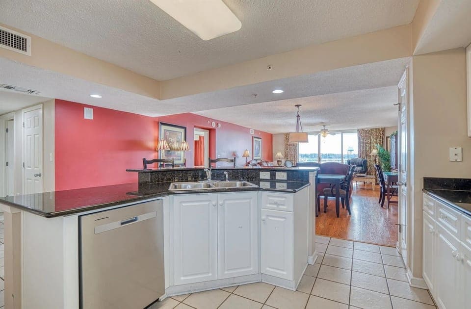 White kitchen with upper cabinets and microwave
