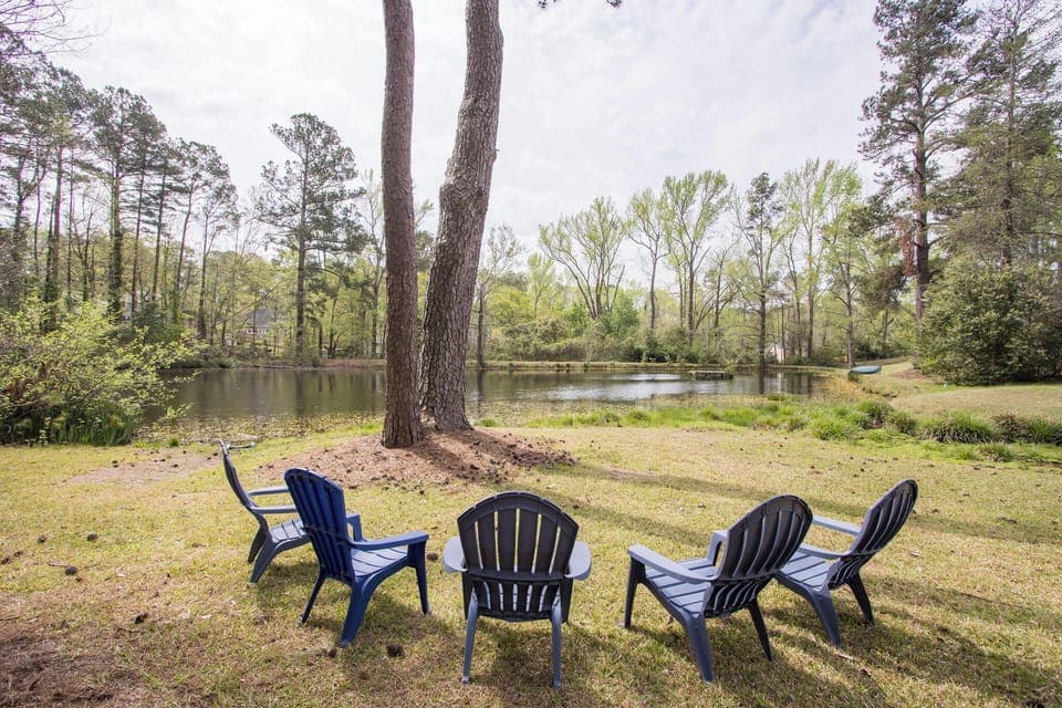 Relax and unwind by the serene pond – the perfect seating for peaceful mornings and tranquil evenings. 🌿✨ #PondSideRetreat #AirbnbVibes