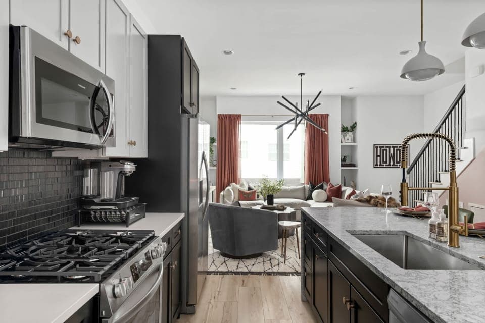 Clean and Spacious Kitchen with Sleek Countertops and Seating