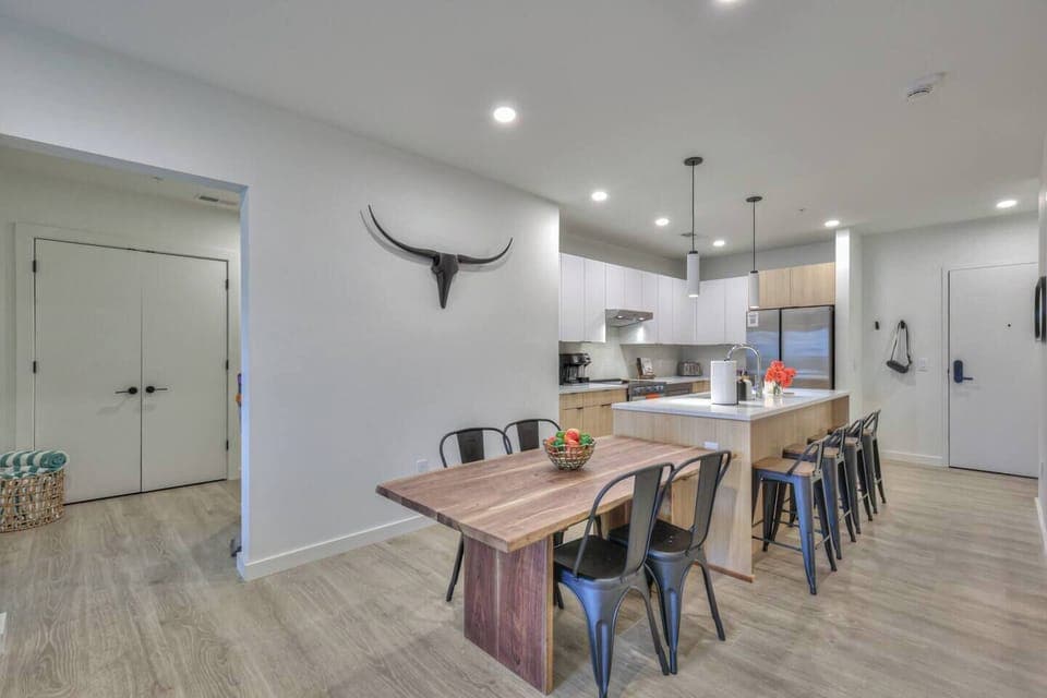 Stainless steel appliances · Fridge & freezer · Oven & stove · Microwave · Dishwasher · Coffee maker · Toaster · Blender · Wine glasses · Outdoor plates · Table & bar seating · Alexa for music · WiFi · BBQ utensils · Baking & cooking basics