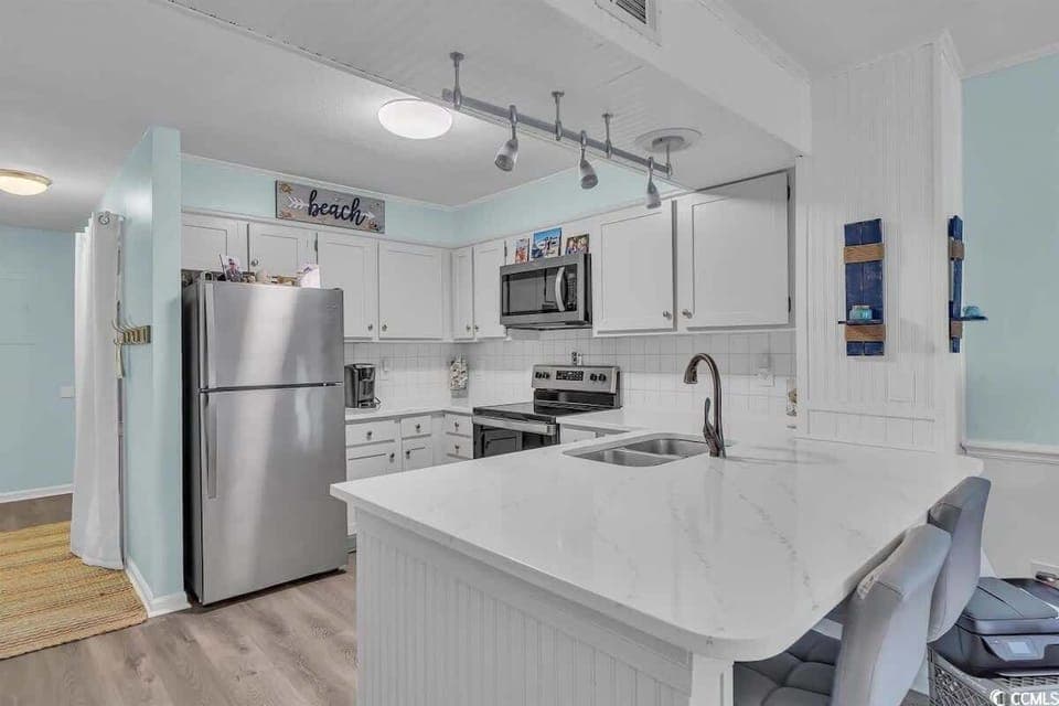 The modern and clean kitchen is a great place to make a family meal