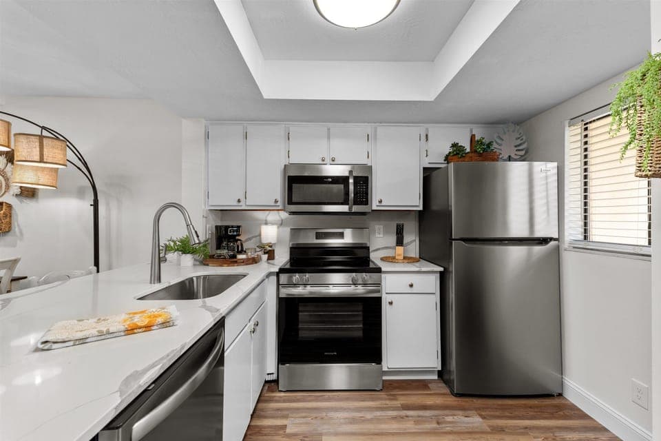fully equipped kitchen with stainless steel appliances 