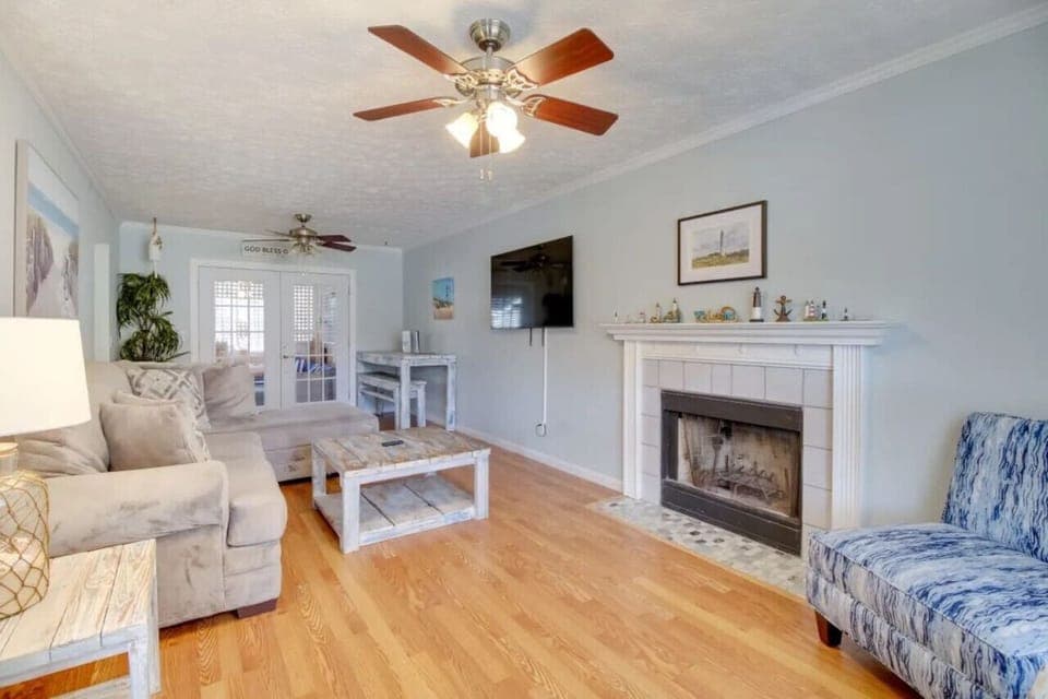 Inviting living room with a blend of modern design and beach-inspired decor, perfect for relaxation and entertaining.