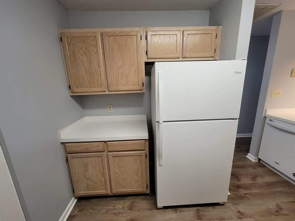 Full refrigerator and freezer with ice maker.