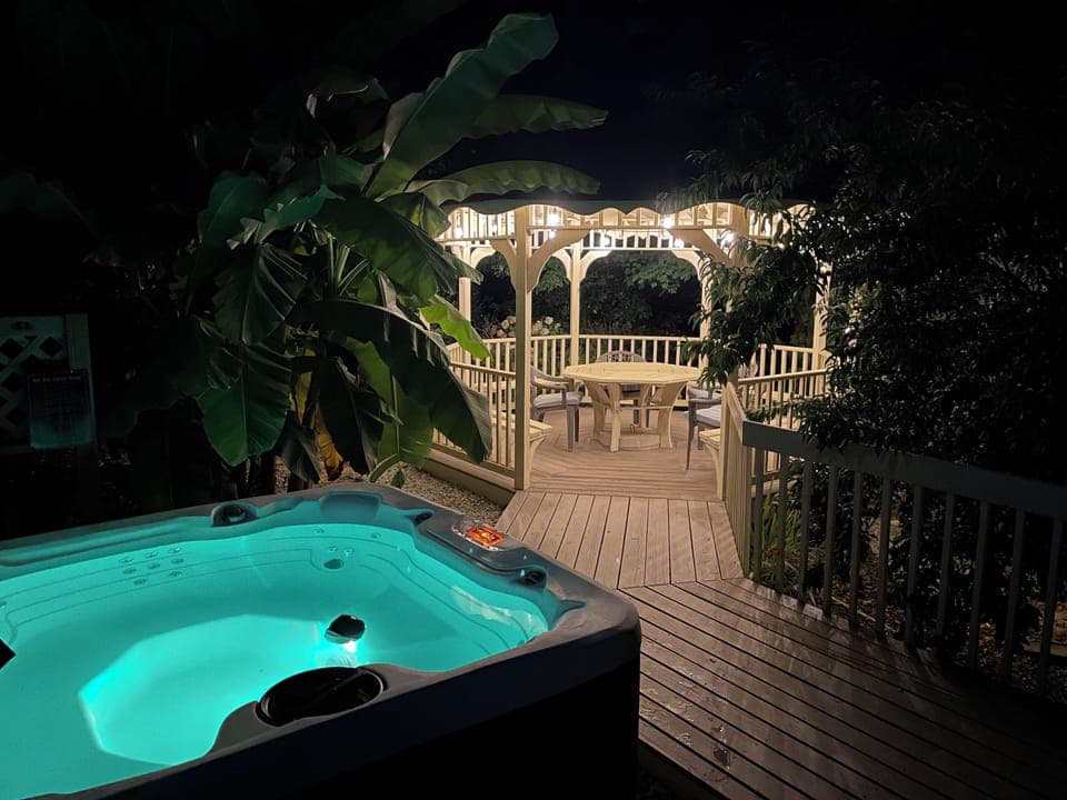 Hot tub and gazebo seating area right off the front porch.
