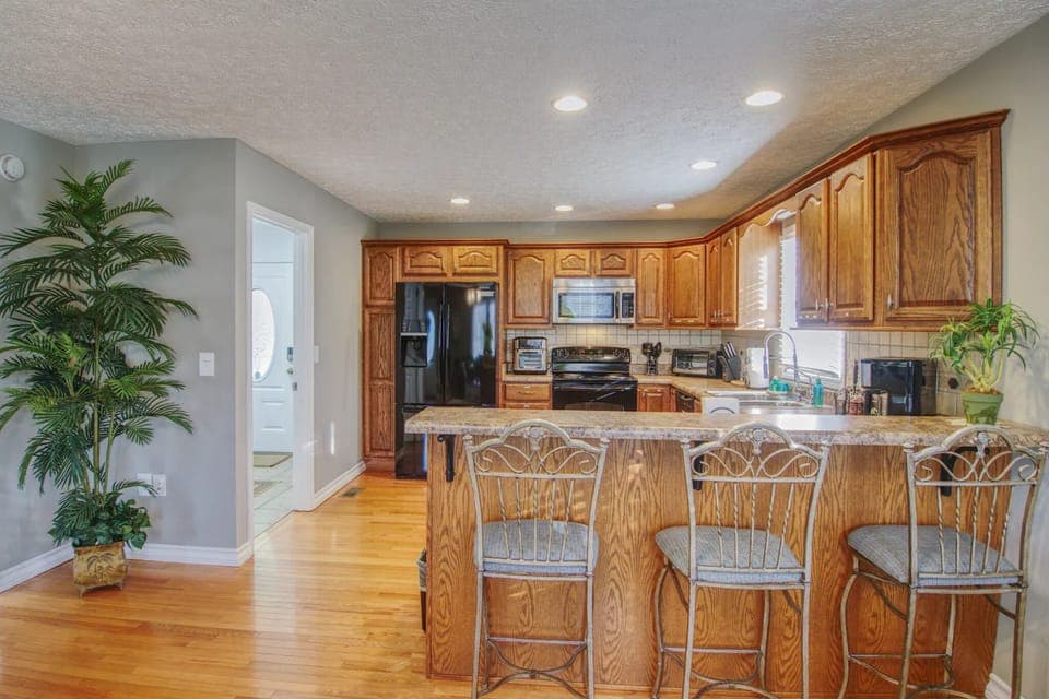 Stylish dining area with a seamless flow from the kitchen, perfect for serving meals fresh off the stove.