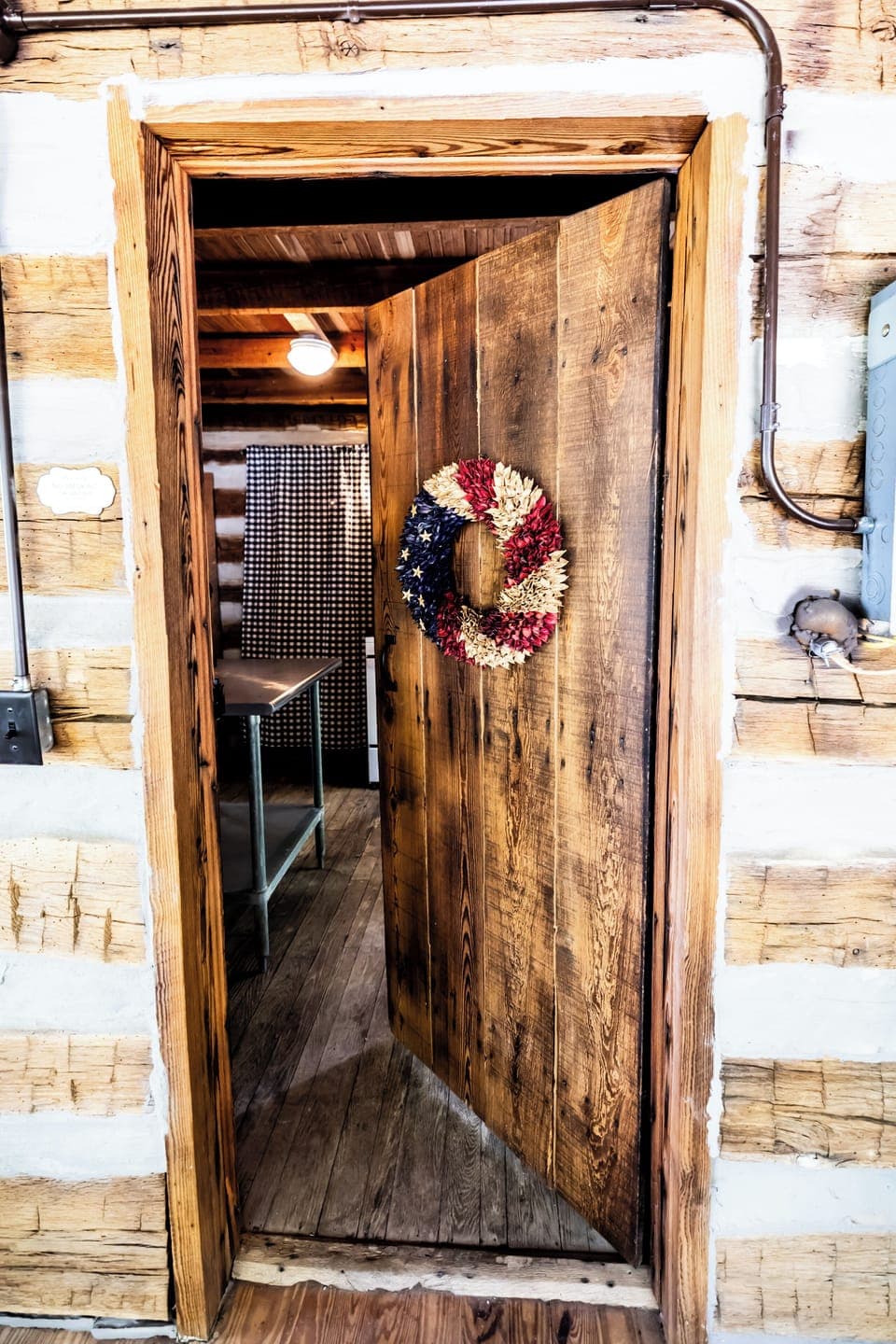 Door from screened in porch leading to inside of kitchen. 