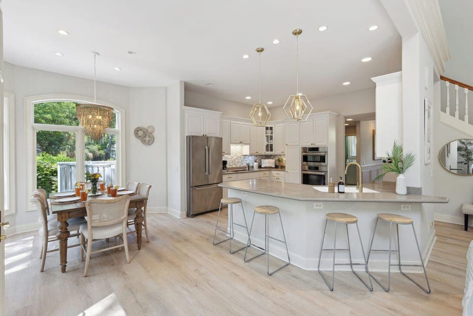 Step into the eat-in kitchen, ideally situated with views of the pool, making it a perfect spot for morning coffee or casual dining