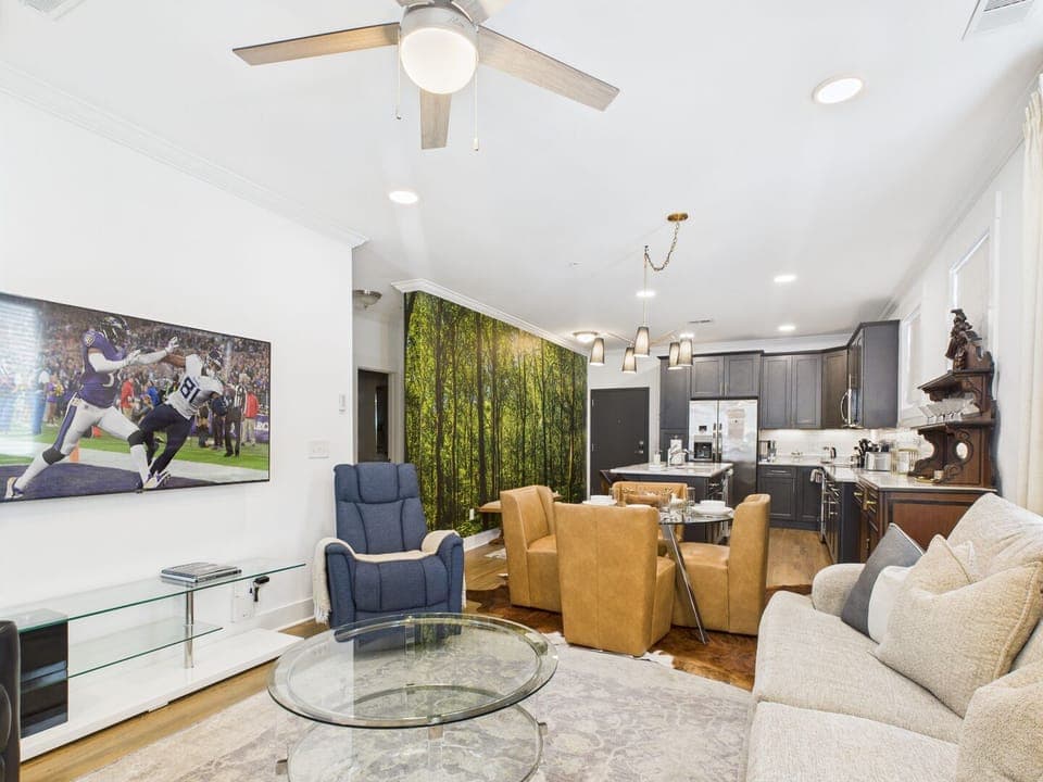 A warm and inviting living room features comfortable furnishings and decor to make you feel at home. A Smart TV provides entertainment, and the living room sofa converts into a Queen-size bed for extra guests.