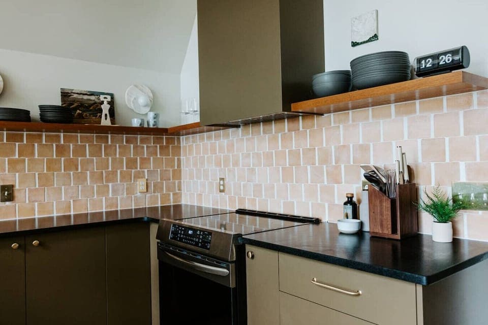 The stove is induction so it heats up fast! You`ll find the kitchen stocked with essentials for cooking - S&P, olive oil, vinegar, and spices, as well as measuring cups, colander, mixing bowls, cooking utensils, etc.