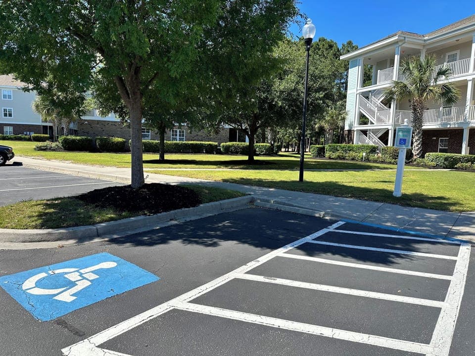 Parking and a paved path that leads to the door of  1st floor,ground level condo