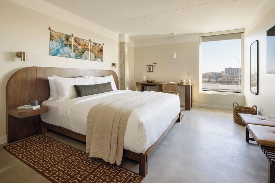 Unwind in crisp linens with sunshine and skyline views.