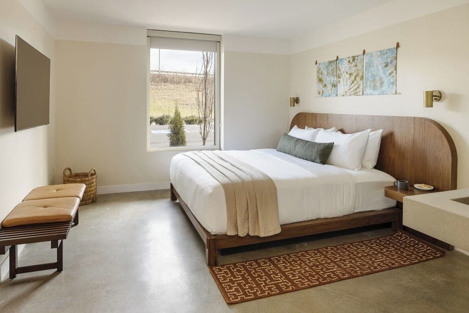 Settle in with plush bedding and a serene, minimalist vibe.