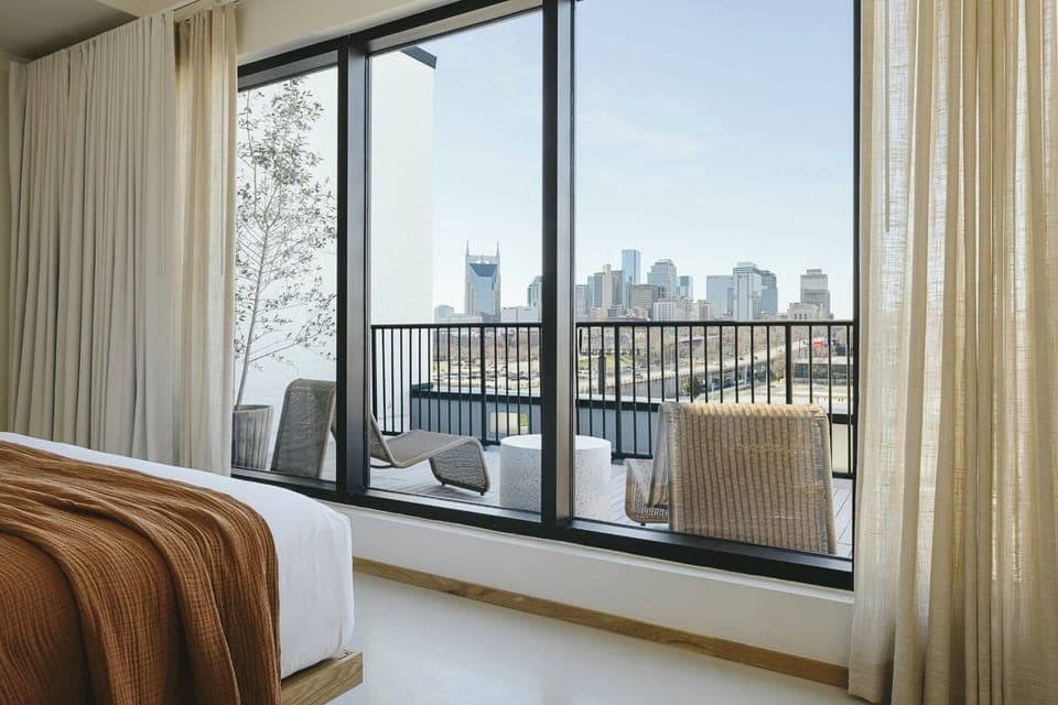 Sip morning coffee while the skyline unfolds beyond your balcony.