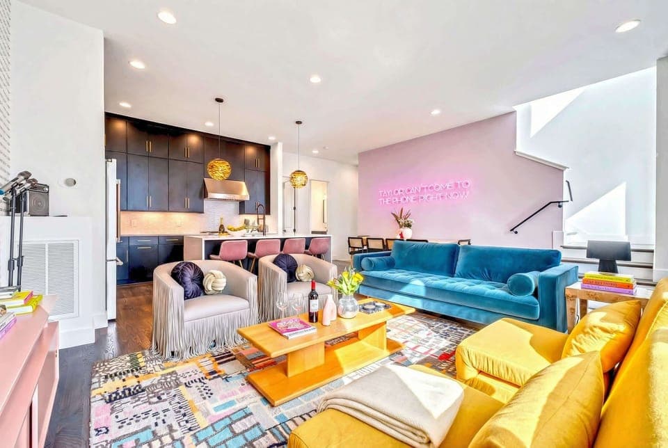 Unwind in this vibrant living space, perfect for a fun Nashville getaway. With modern design and cozy seating, it's ideal for gatherings. Book your Misfit Homes stay today!
