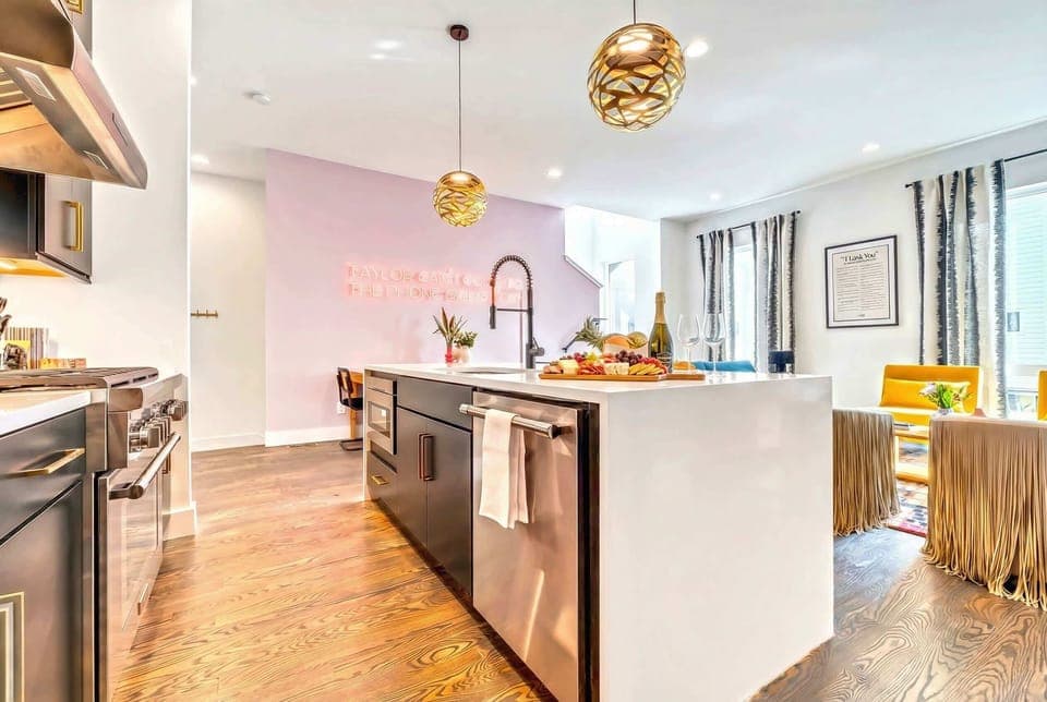 Step into this stunning Nashville Luxury Vacation Home, where modern design meets vibrant charm! Perfect for your group getaway, enjoy an inviting kitchen and chic seating. Book now with Misfit Homes to create unforgettable memories in Music City!