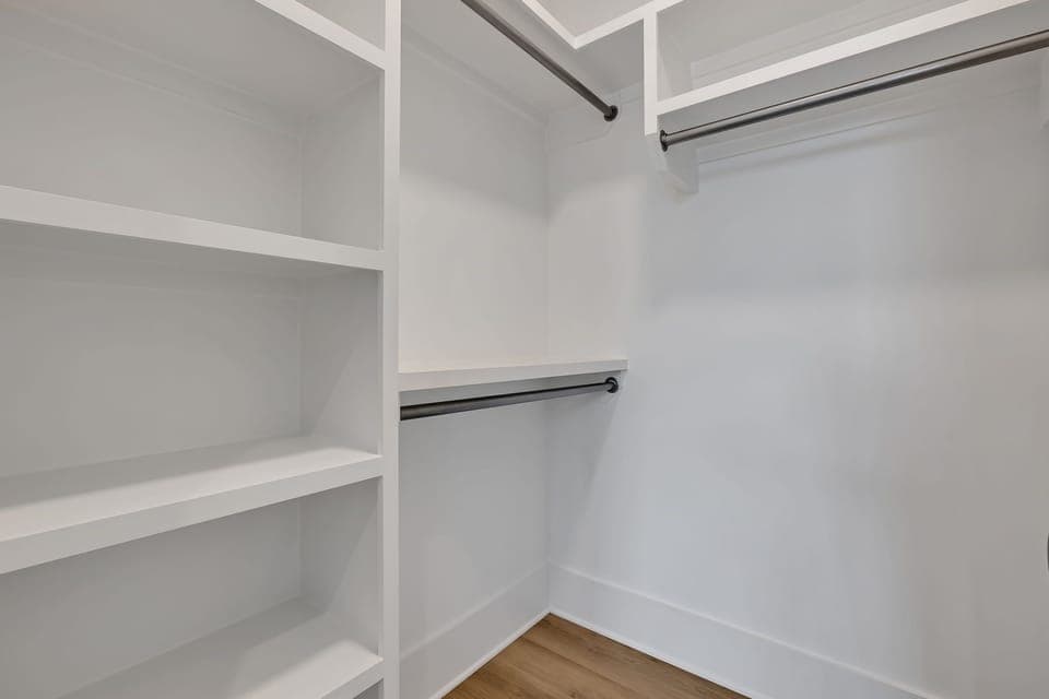 Unit 1 - 3rd Floor: Primary Bedroom featuring a luxurious King bed with a Smart TV, a walk-in closet and an ensuite Primary Bathroom.