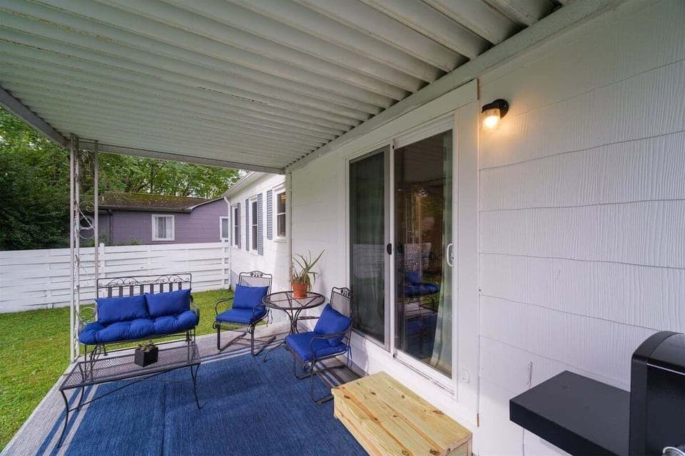 Covered Back Porch with Seating and Gas Grill