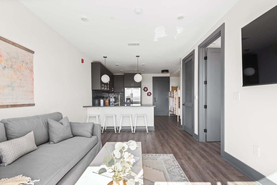 Bright and Clean Living Room with Large Windows and Cozy Vibes