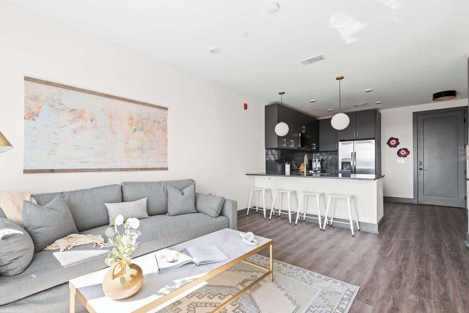 Bright and Clean Living Room with Large Windows and Cozy Vibes