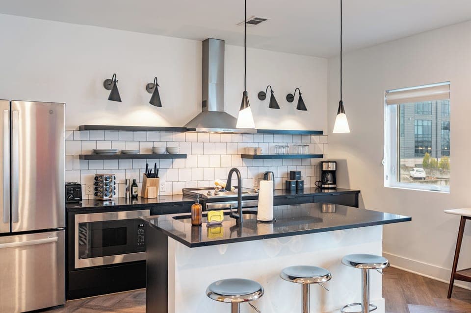 A stylish, well-equipped kitchen where modern design meets everyday comfort.