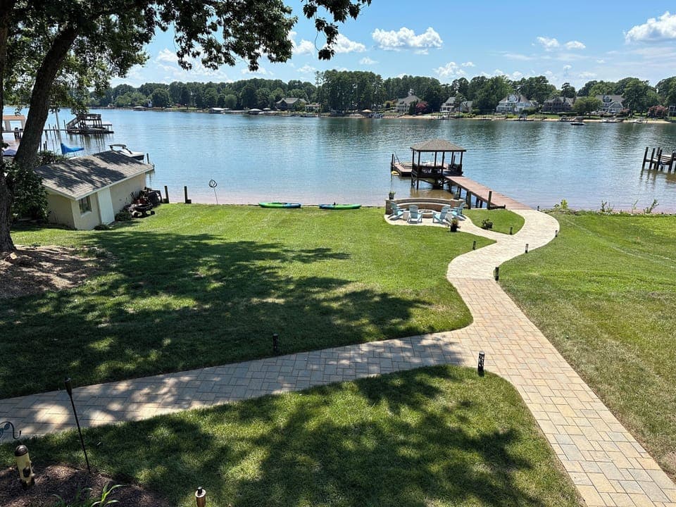 Walk out to the private beach, firepit, gazebo over the water and floating dock 