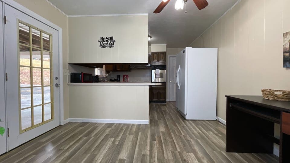 Step into style! ✨ A clean, inviting path leads to a beautifully designed kitchen ready for your culinary adventures. 🍽️