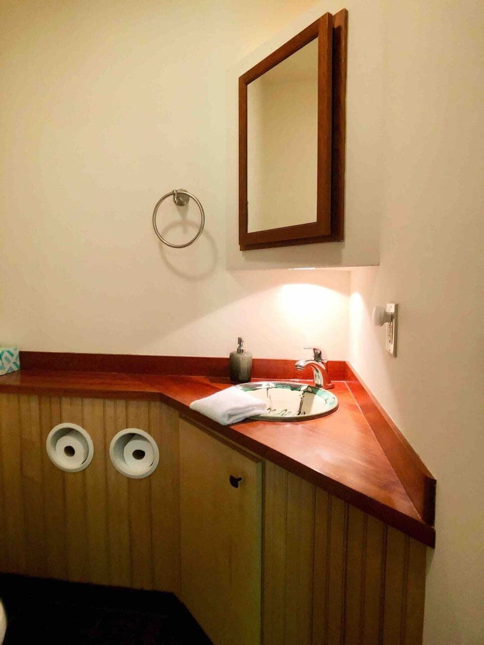 The half bath just off the living room has a handmade sink by friends at Fork Mountain Pottery.