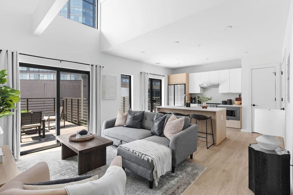 Stunning high ceilings, open floor plan, and lots of natural light in this premium downtown condo. All the most comfortable furnishings and details provided for ease of your stay.