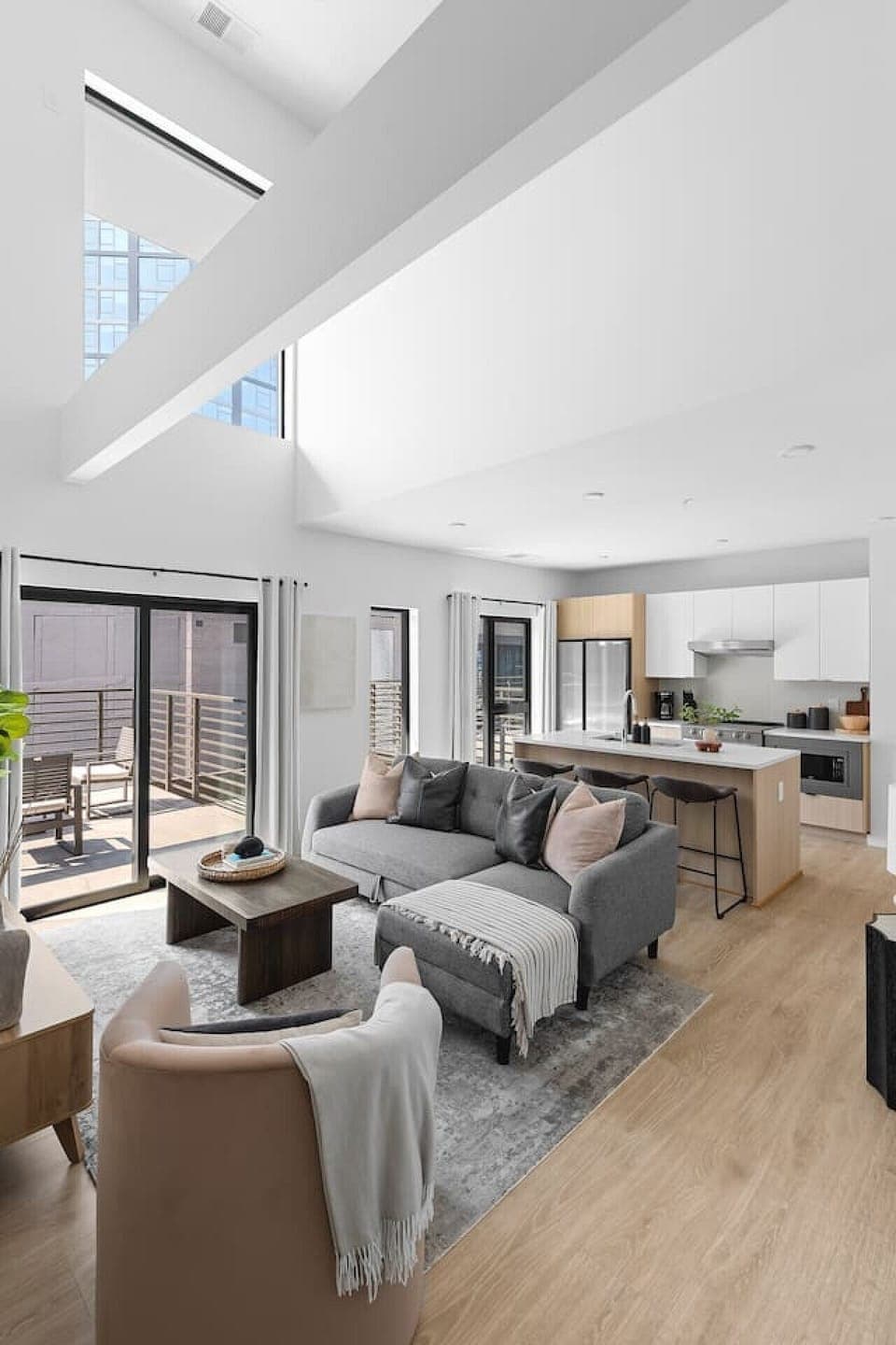 Stunning high ceilings, open floor plan, and lots of natural light in this premium downtown condo. Smart TV in the living room with all the streaming apps and a comfortable sleeper sofa. Glass sliding doors leading to the spacious private patio.