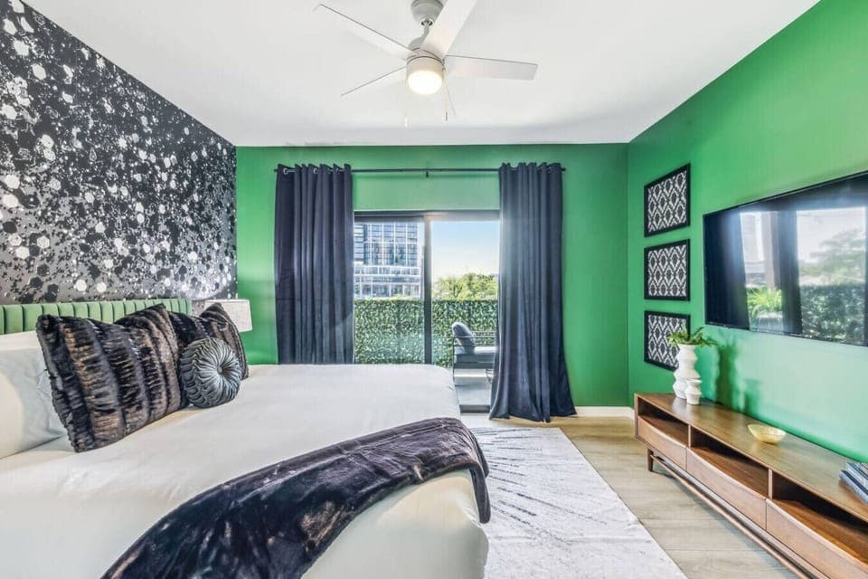 Bedroom with King Bed, Smart TV, and patio access