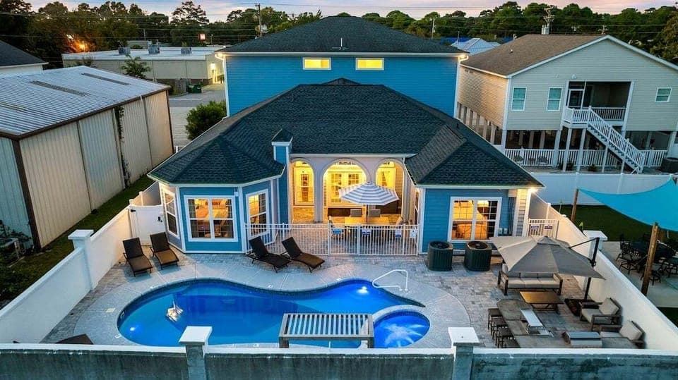 Blue Paradise's vibrant blue façade welcomes you to 5,000 sq ft of luxury and comfort, perfect for family reunions or group getaways.
