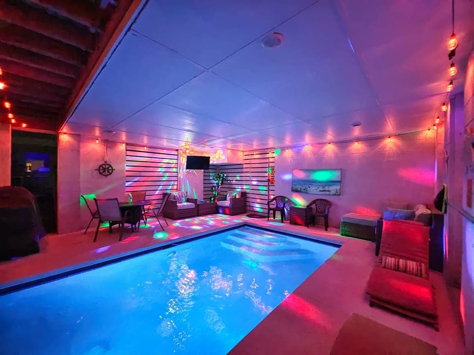 Grotto style pool with water view.