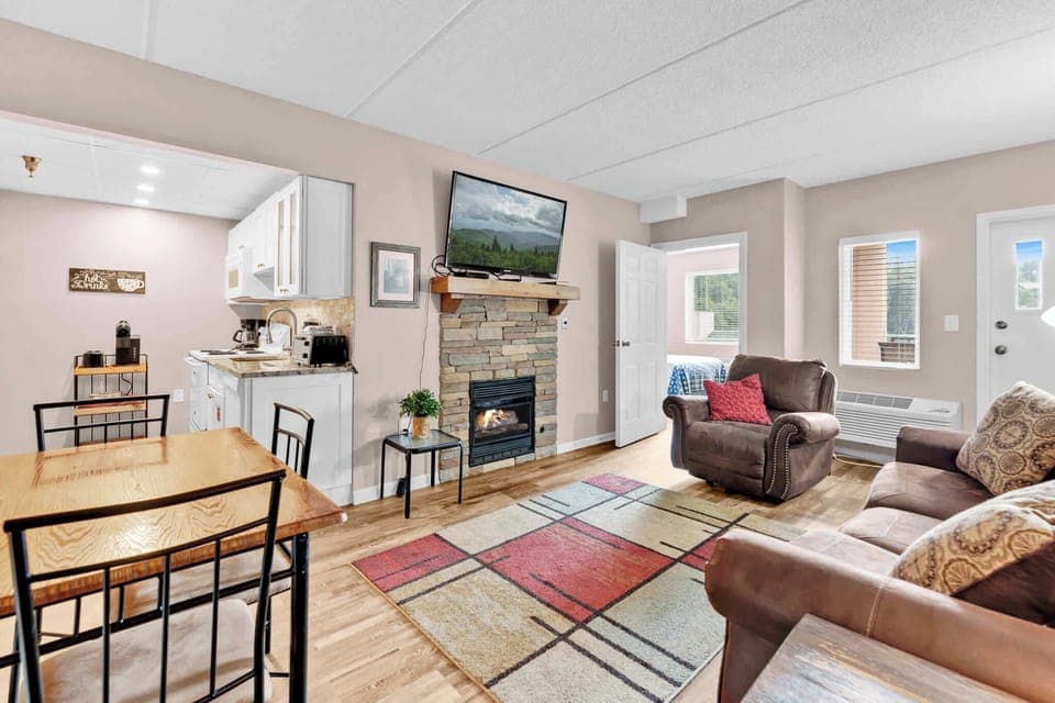 Curl up in the cozy living room & enjoy a fireside movie night at home