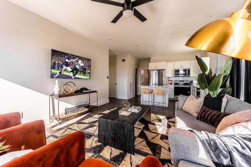 Open concept living area with comfortable seating and TV