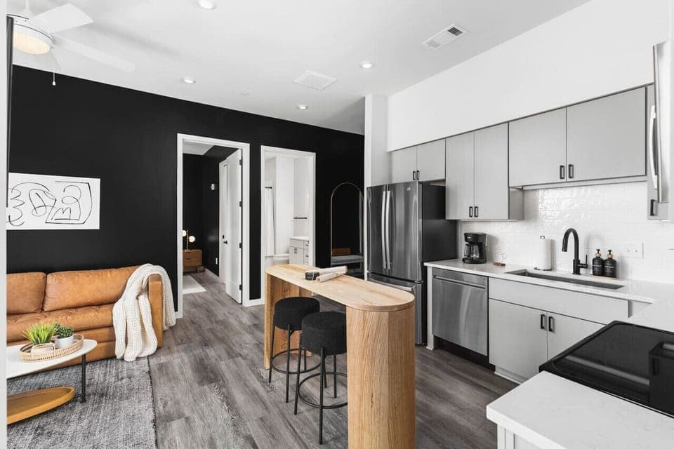 Lots of natural light pouring into this fully equipped kitchen. Seating for two at the island. We provide all the utensils you might need to enjoy a meal at home.