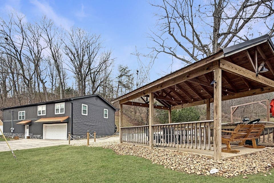 Garage doors open up so family and friends can enjoy the inside games and the pond amenities together