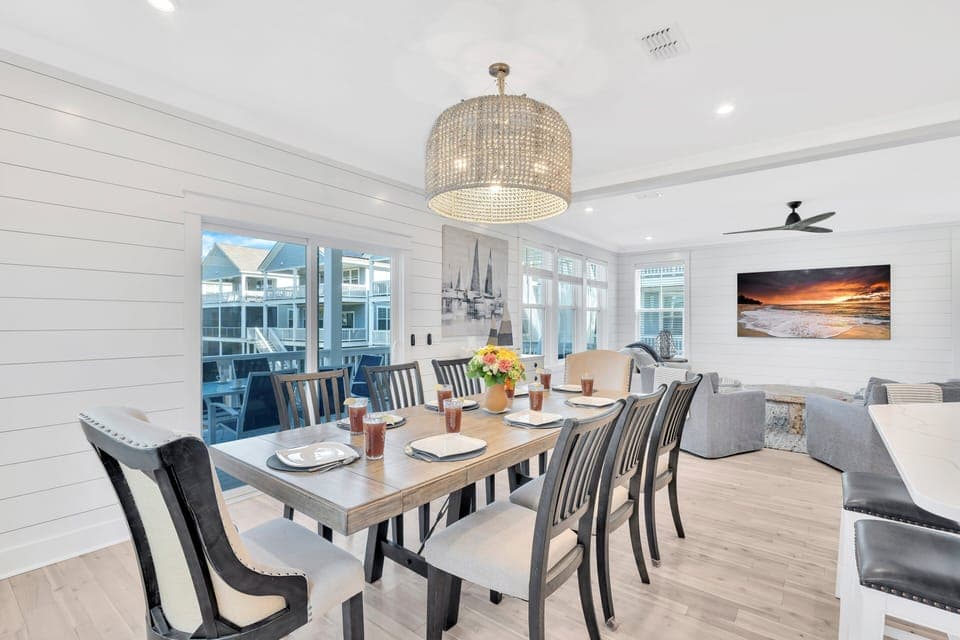 Formal dining area seats 8 + 6 at the kitchen island and additional seating outside at the porch
