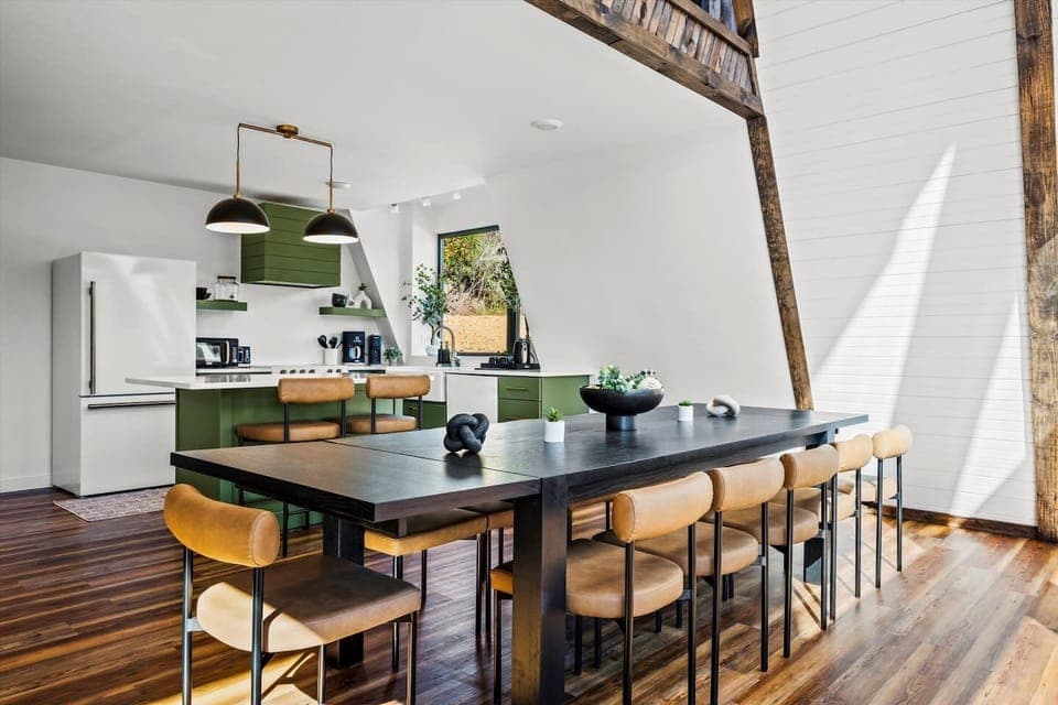 Modern double a-frame with designer kitchen & seating for 10—perfect for group meals and cozy nights in.