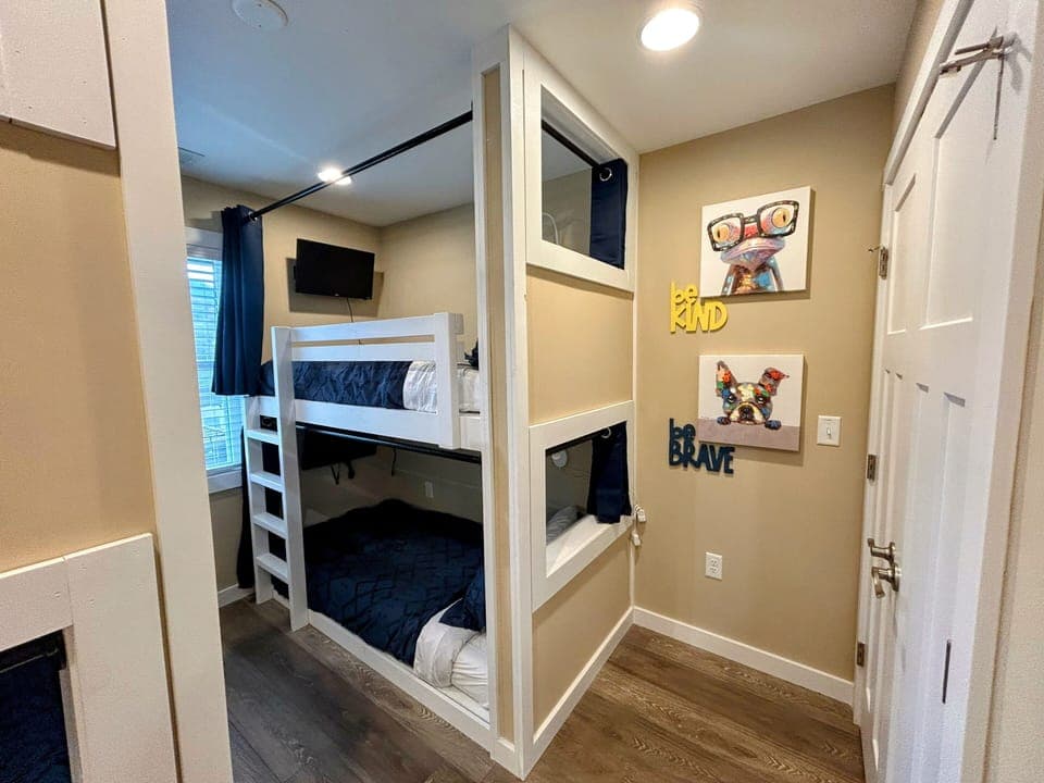 Fabulous kids space! Bunkroom that kids love! Each cubby has SmartTV and curtain