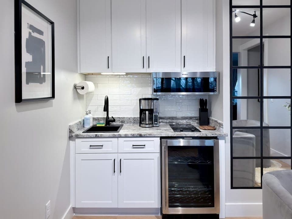 Lower Level Kitchenette - Perfect for groups and extra comfort, our lower-level kitchenette is fully stocked for easy snacks, drinks, and quick meals,so you don’t have to run upstairs every time you want a coffee refill or a late-night bite. 
