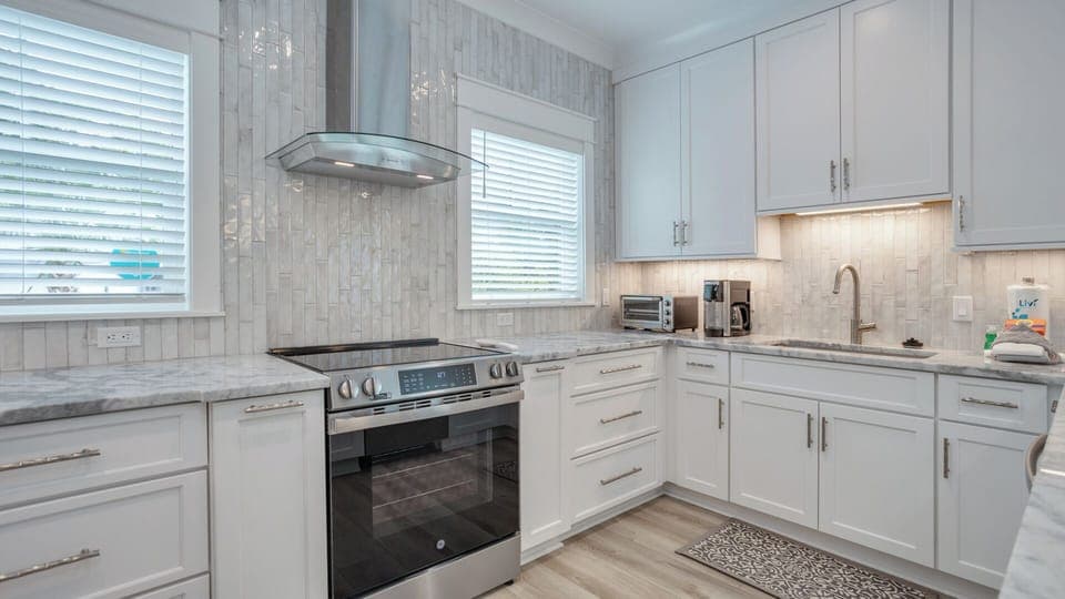 With ample storage and a clean, coastal feel, this kitchen is ready for effortless cooking and entertaining.