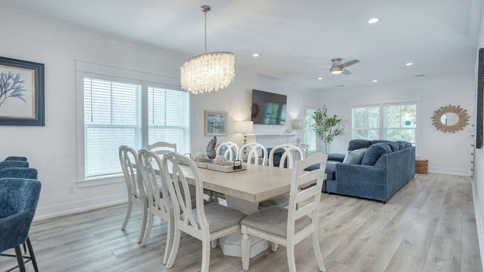The adjacent dining area and beautifully updated kitchen provide an effortless layout for entertaining and everyday living.