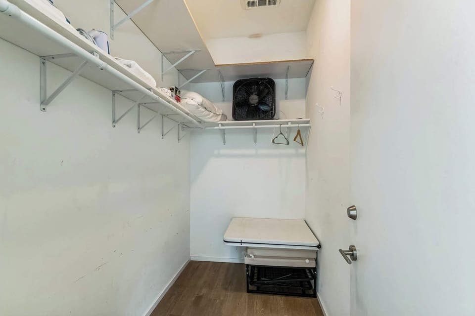 Keep clothes and bags neatly tucked away in the second bedroom closet