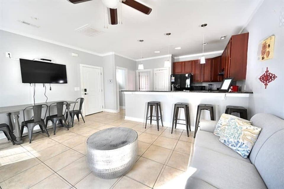 Open-concept living area with island seating and cozy lounging